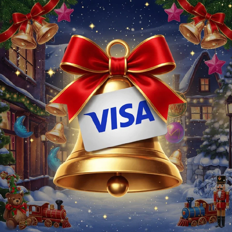 Visa logo on a Christmas scene with a gold bell with a red bow and a blank gift tag