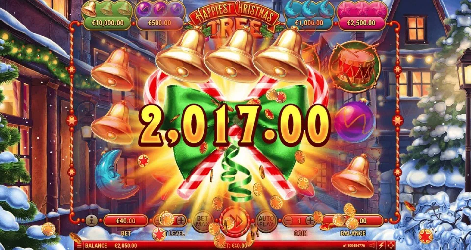 Happiest Christmas Tree base game with a 2,017 win shown over three gold bells and a green bow