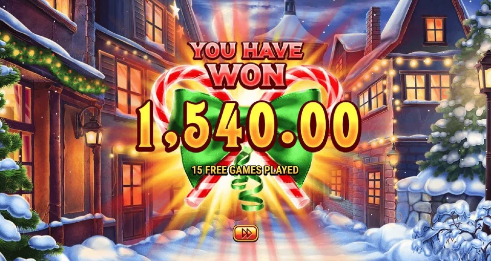 Happiest Christmas Tree total win screen after 15 free games, framed by candy canes and a green bow