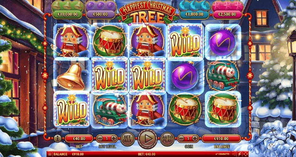 Happiest Christmas Tree reels with frosted frames marked WILD among drums, bells and nutcrackers